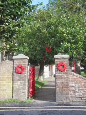 Poppy Wreaths at the side gate of Tring Church for Armistice Day